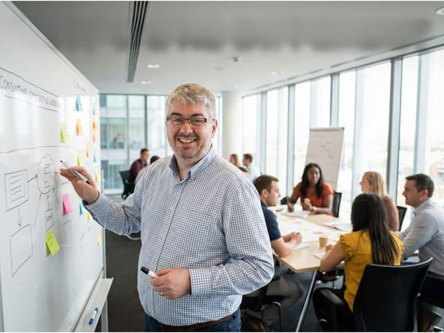 Miha consulting with business owners